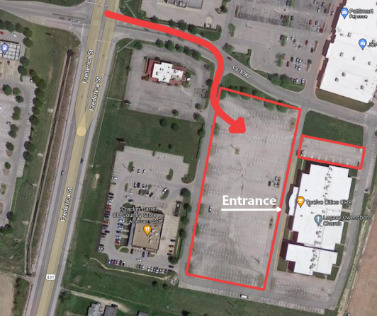 The arrow in this picture leads through the wrong side of the street. Though adventurous, we encourage you to drive on the correct side of the road when approaching the venue.